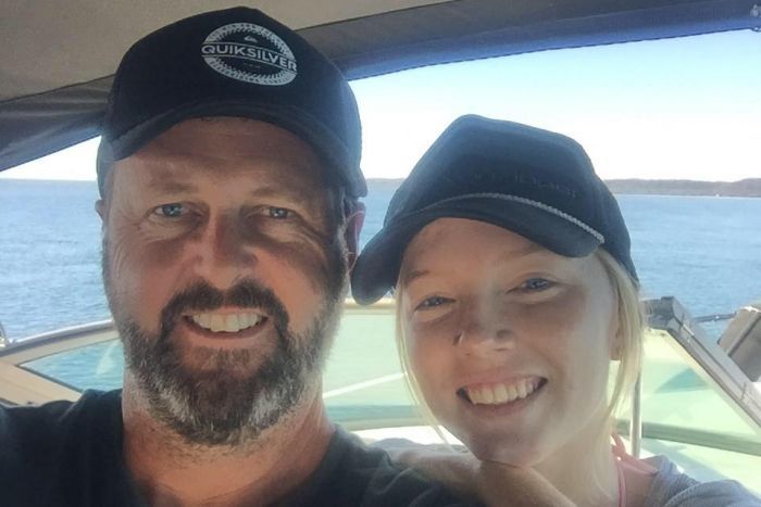 Mark Wallace with Sara Zelenak smiling on a boat