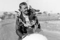 Jack Ahearn with the winner's garland after success at Bathurst in 1957.

