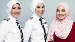 AirAsia pilots wearing the new hijab with designer Neelofa.