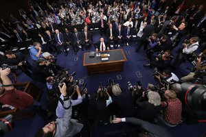 Former FBI director James Comey takes his seat at the beginning of the Senate Intelligence Committee hearing on Capitol Hill, Thursday, June 8, 2017, in Washington.