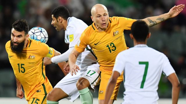 Aaron Mooy and Mile Jedinak in the midst of the action. 