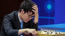 Chinese Go player Ke Jie reacts as he plays a match against Google's artificial intelligence program, AlphaGo, during ...