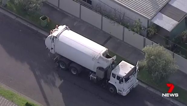 The driver of this garbage truck discovered the body.