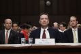Former FBI director James Comey sits before the Senate Intelligence Committee.
