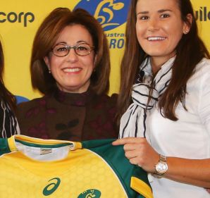 Wallaroos stars Sharni Williams (left) and Shannon Parry (right) with Buildcorp's Josephine Sukkar. 