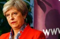 Britain's Prime Minister Theresa May listens as the declaration at her constituency is made for in the general election.