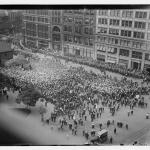 Photograph of the demonstration from an office by the square