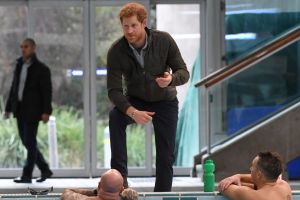Prince Harry meets defence veteran swimmers after touring the Sydney International Aquatic Centre, where the Invictus ...