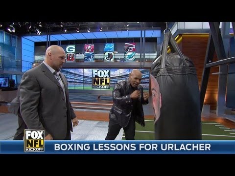 Mike Tyson gives Brian Urlacher boxing lessons