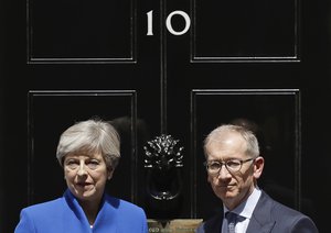 of 10 Downing Street, London, after addressing the press Friday, June 9, 2017 following an audience with Britain's Queen Elizabeth II at Buckingham Palace where she asked to form a government.