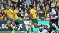 MELBOURNE, AUSTRALIA - JUNE 10:  Israel Folau of the Wallabies runs with the ball as Karmichael Hunt looks on during the ...