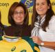 Wallaroos stars Sharni Williams (left) and Shannon Parry (right) with Buildcorp's Josephine Sukkar. 