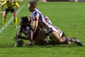 Controversy: Akuila Uate drops the ball over the line, but the try was awarded.