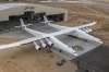 28 wheels, six 747 jet engines: World's largest plane rolls out of the hanger.
