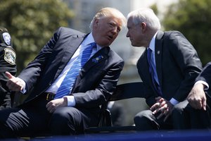 File - Attorney General Jeff Sessions talks to President Donald Trump during the 36th annual National Peace Officers Memorial Service, Monday, May 15, 2017, on Capitol Hill, Monday in Washington.