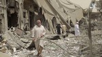 File - This undated frame grab from video posted online Monday, May 29, 2017, by the Aamaq News Agency, a media arm of the Islamic State group, shows people inspecting damage from airstrikes and artillery shelling in the northern Syrian city of Raqqa, the de facto capital of the IS.