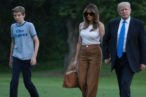 President Donald Trump, first lady Melania Trump, and their son Barron Trump walk from Marine One across the South Lawn ...