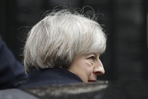 British Prime Minister Theresa May gets in a car as she leaves 10 Downing Street in London, to attend Prime Minister's Questions at the Houses of Parliament, Wednesday, Feb. 1, 2017.