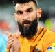 Niggling injury: Mile Jedinak (r).