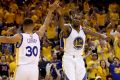 Easy going so far: Kevin Durant and Steph Curry high five during game two. 