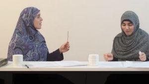 Reem Allouche, left, and Atika Latifi, from the Women of Hizb ut-Tahrir Australia, use a sivaak, or small stick, to ...