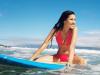 Woman on surfboard in Hawaii.
