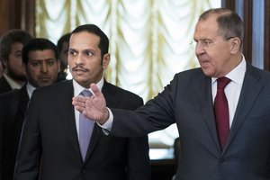 Russian Foreign Minister Sergey Lavrov, right, welcomes Qatari Foreign Minister Sheikh Mohammed bin Abdulrahman bin Jassim Al-Thani during their meeting in Moscow, Russia, Saturday, June 10, 2017.