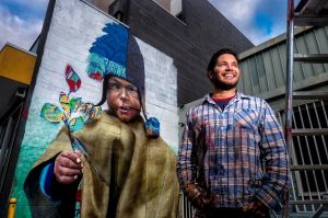 MELBOURNE,AUSTRALIA -29 MAY 2017: Photo of Colombian born Artist Julian Clavijo working on an Inca boy Mural at Nerudas ...