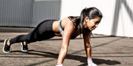 woman does plank exercise