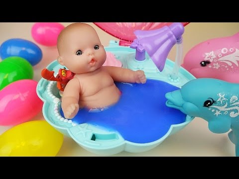 Baby doll Dolphin swim and Surprise eggs Slime Shellfish bath toys