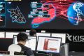Employees watch electronic boards to monitor possible ransomware cyberattacks at the Korea Internet and Security Agency ...
