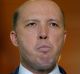 "It is a bill that suits the times we're living in," Immigration Minister Peter Dutton said.