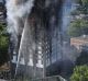 Firefighters tackle the building after a huge fire engulfed the 24-storey Grenfell Tower in Latimer Road, West London.