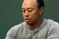 Under the spotlight: Tiger Woods, pictured at a book signing in May.