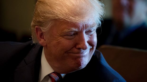 President Donald Trump smiles during a Cabinet meeting.