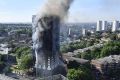 Smoke rises from Grenfell Tower in west London.