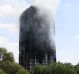 Smoke continues to rise from the burning 24-storey Grenfell Tower block in Latimer Road, West London.