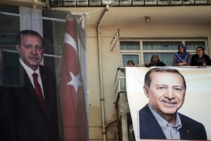 Supporters wait for the arrival of Turkey's President Recep Tayyip Erdogan for a last referendum rally in Istanbul, Saturday, April 15, 2017.