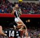 Jeremy Howe of the Magpies marks the ball over Tom McDonald of the Demons. 