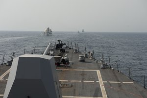 File - The guided-missile destroyer USS Nitze transits the Strait of Hormuz with Military Sealift Command missile range instrumentation ship USNS Invincible and British Royal Navy ships HMS Ramsey, HMS Pembroke and RFA Lyme Bay, 19 May, 2012.