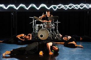 Drummer Myele Manzanza and dancers Elle Evangelista​, Timothy Ohl and Anna Seymour in Out of Earshot.