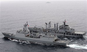 In this photo released by the Korean Navy via Yonhap, South Korean warships participate in joint military drills with the United States, in South  Korea's East Sea on Wednesday, July 28, 2010.