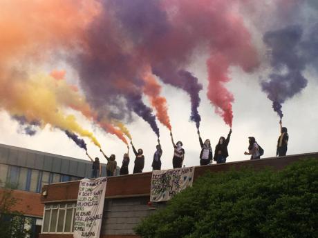 Image credit @sistersuncut, flares on the roof of Holloway Prison