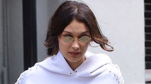 Bella Hadid doing her bit to make tiny glasses happen. 