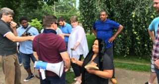 Bible in hand and on bended knees, activist Veronica Fitzhugh asks Jason Kessler, whom she's called a "Nazi," for forgiveness.
Staff photo