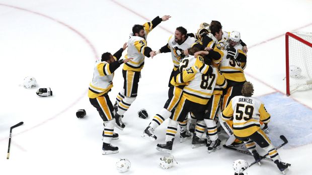 Matt Murray of the Pittsburgh Penguins celebrates with teammates after they defeated the Nashville Predators 2-0 to win ...