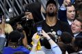 Beer o'clock: Kevin Durant celebrates after the Warriors' victory.