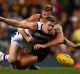 PERTH, AUSTRALIA - JUNE 15: Scott Selwood of the Cats dives for the ball against Nathan Vardy of the Eagles during the ...