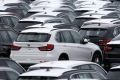 Bayerische Motoren Werke AG (BMW) vehicles, assembled in the U.S., sit parked before being driven onto vehicle carrier ...