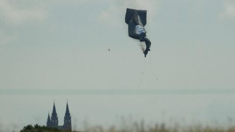 A blimp falls to the ground  during the first round of the US Open golf tournament.